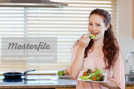 Girl having healthy fresh salad