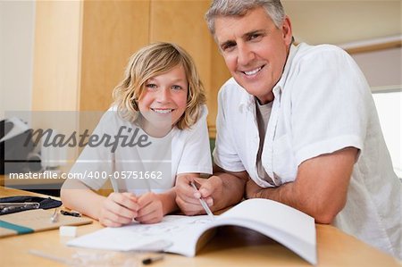 Father helping his son with his homework