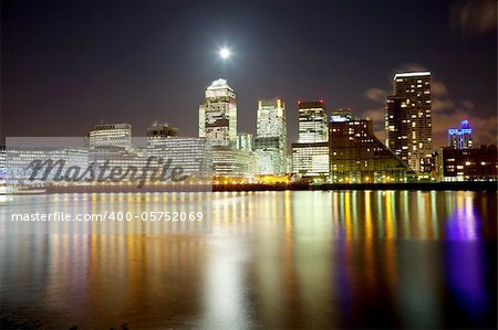 Full moon over London skyscrapers