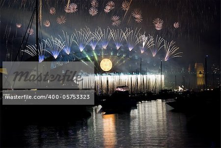 Sparkling New Year Eve nye Fireworks in Sydney Harbour Sky Line At Night, NSW, Australia, Oceania. The Sydney harbour bridge and sydney opera house sparkling in the night. Colourful surface. Night scene