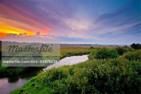 Summer landscape with river at sunset