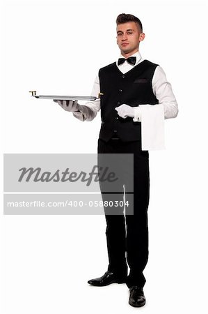 A young boy waiter with a tray. Isolated background and clipping path