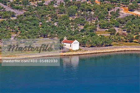 Mediterranean style chapel made of stone by the sea, Island Cres, Croatia