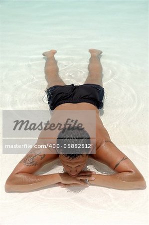 A man is relaxing in swimming pool