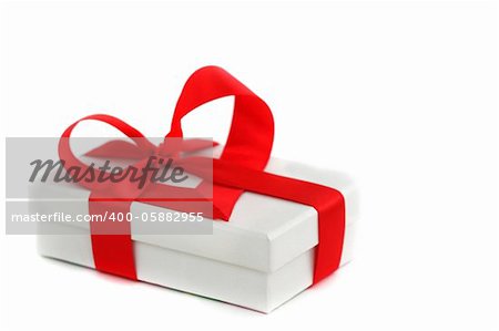 white christmas gift with red heart ribbon