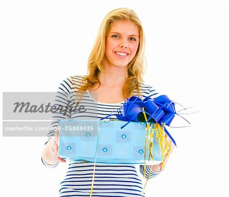 Portrait of beautiful teen girl with present box in hand