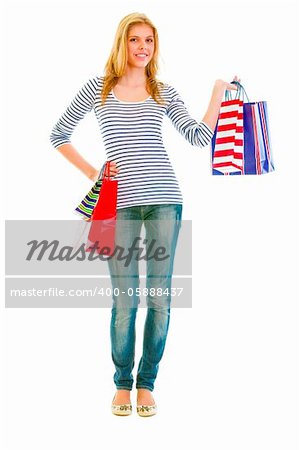 Full length portrait of happy teen girl with shopping bags
