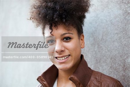 Portrait of a beautiful smiling young woman outdoors.