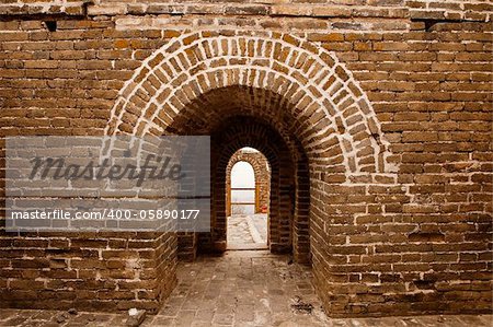 An architectural details view looking through the arches of one of the guard towers on the landmark Great Wall of China