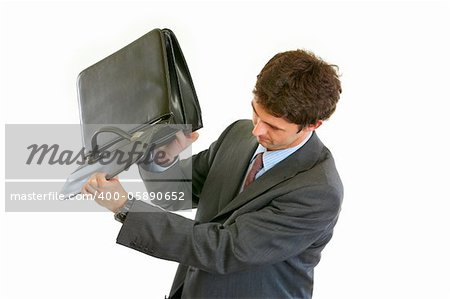 Modern businessman shakes out something from briefcase