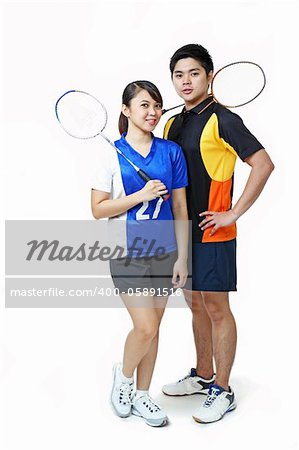 Young asian athletic couple isolated in solid background.