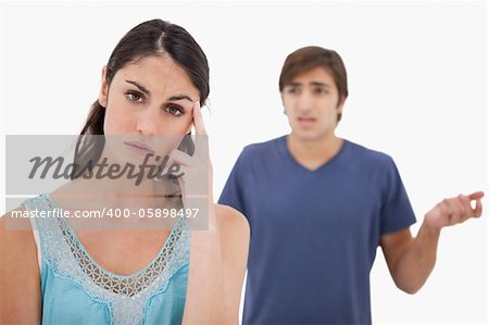 Woman mad at her fiance against a white background