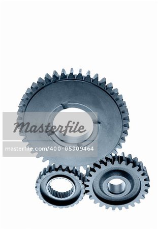 Three cogs on plain background