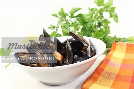 fresh steamed mussels in a bowl with napkin