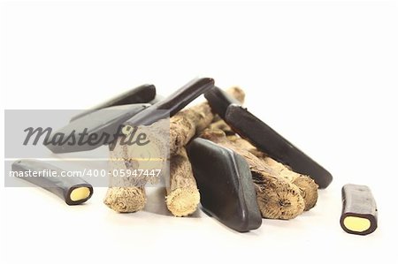 licorice root with liqorice on a bright background