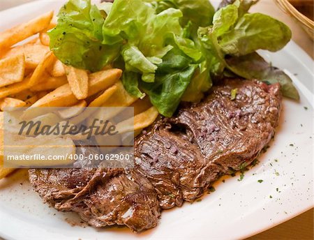 juicy steak beef meat with tomato and french fries