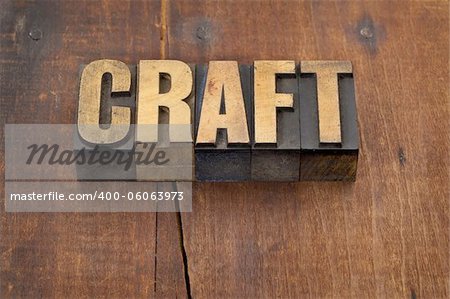 craft word in vintage letterpress wood type against grunge weathered wooden background