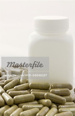 Herbal medicine capsule on white background