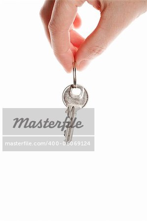 Hand and key isolated on white background