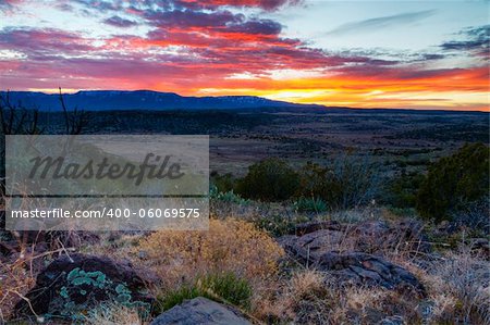 Sun setting behind Woodchute mountain near Sedona, Arizona