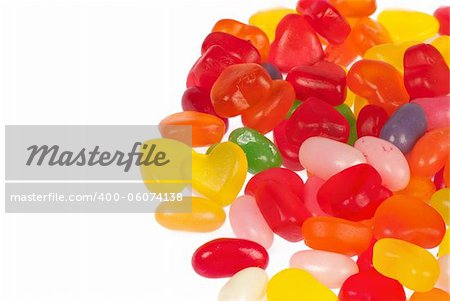 Assortment of fruity jelly beans on white