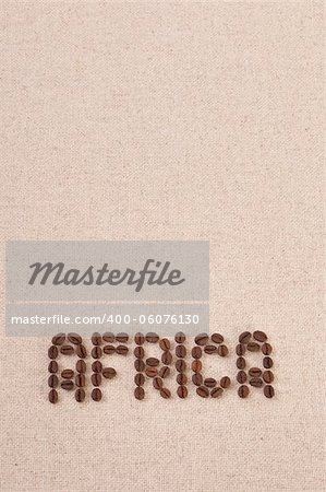 The word Africa written with selected coffee beans on canvas background