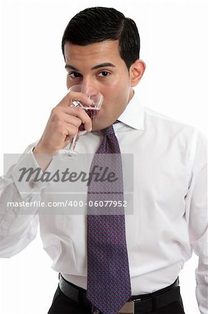 A man tasting or drinking a glass of sparkling red wine made from shiraz grapes.  White background.
