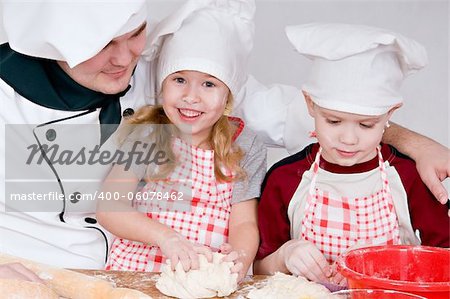 chef and children in the chefs prepare a meal