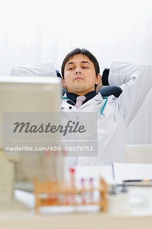 Portrait of thoughtful medical doctor at office