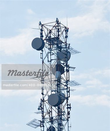 Communication tower over a blue sky close image