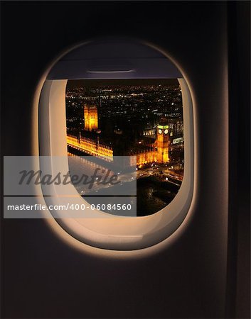 Approaching destination London UK, jet plane window night view