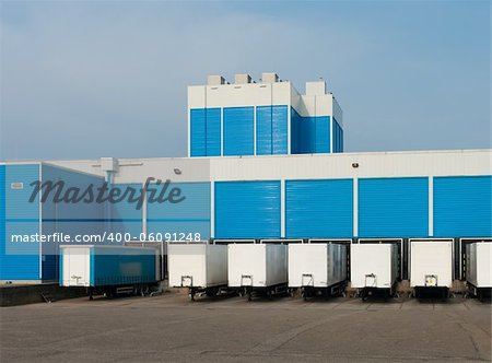 modern blue warehouse with loading docks