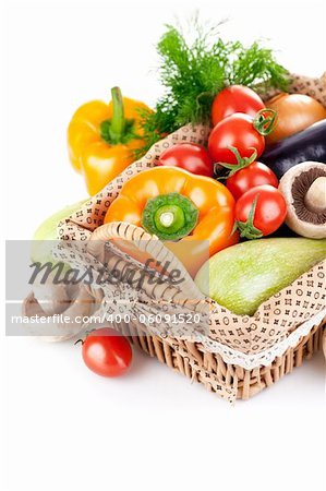fresh vegetables with leaves in the basket isolated on white background