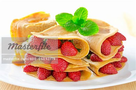 Fresh strawberry pancake on plate