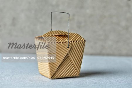 Image of a generic "to go" box made of recycled brown cardboard