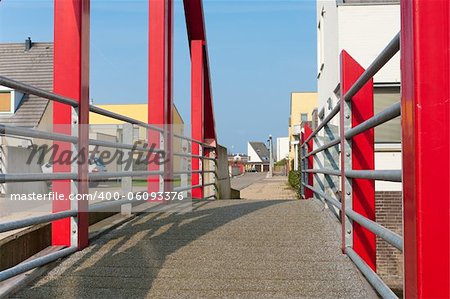 modern red footbridge in Beuningen, Netherlands