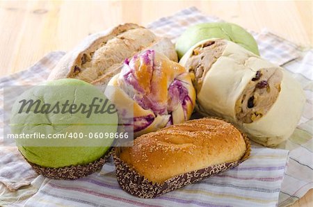 Variety of Breads on plank background