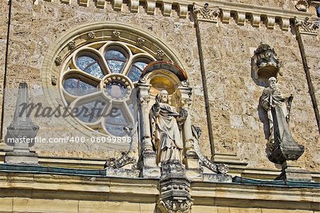 Church architectural detail - window and saint statue, Marija Bistrica, Croatia