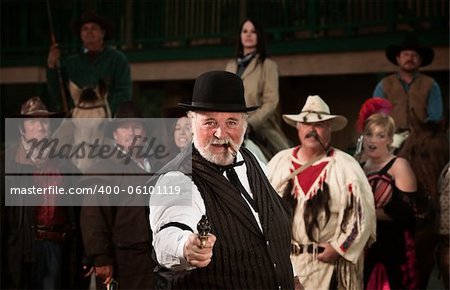 Gunshooter with gang in old American west theme