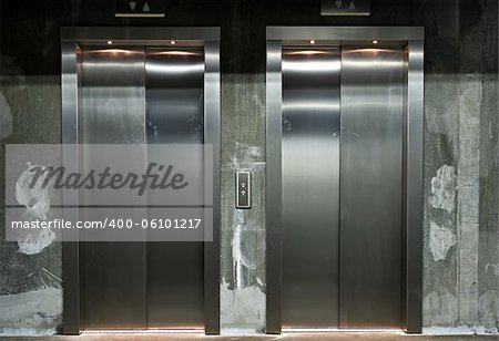 new elevator doors with raw concrete wall