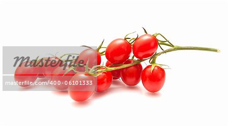 plum tomatoes on the vine on white surface, isolated
