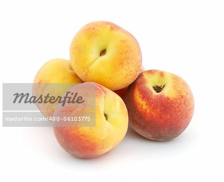 Pile of peaches isolated on white background