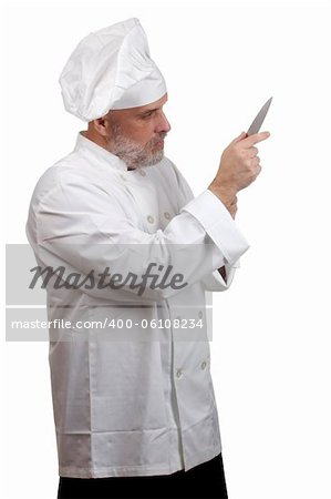 Portrait of a caucasian chef in his uniform on a white background.