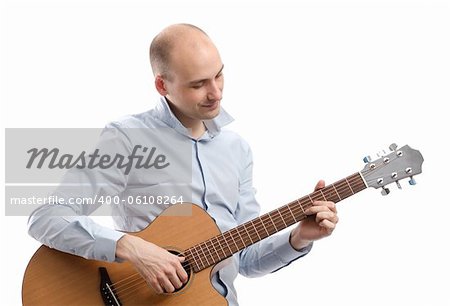 Guitarist playing acoustic guitar isolated on white