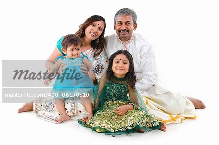 Happy Indian family sitting on white background