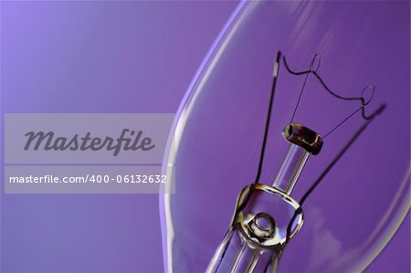 close up of light bulb on blue purple background