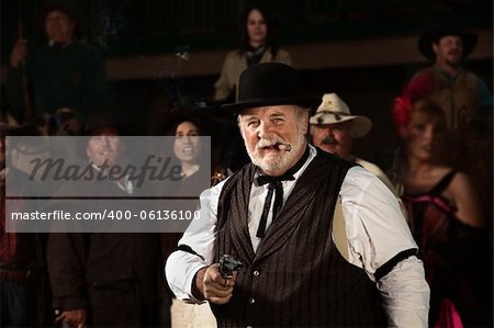 Smiling old west bad guy with cigar and revolver