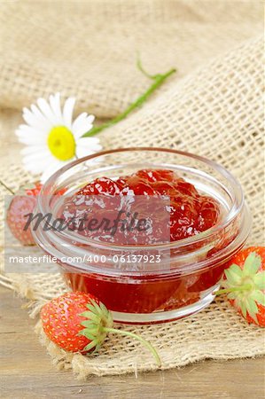 strawberry jam and fresh berries on the table