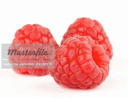 Arrangement of Fresh Ripe Perfect Raspberry isolated on white background