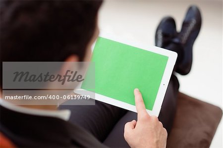 Business man using digital tablet pc with green screen for internet and email
